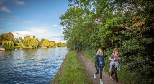 People walking on a river path